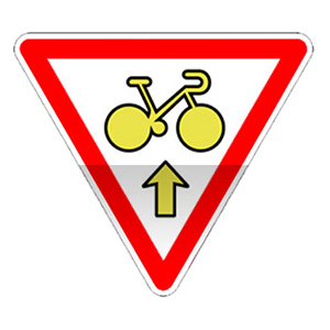 Panonceau autorisant un cycliste à franchir la ligne d'arrêt du feu afin de s'engager sur la voie située en continuité.